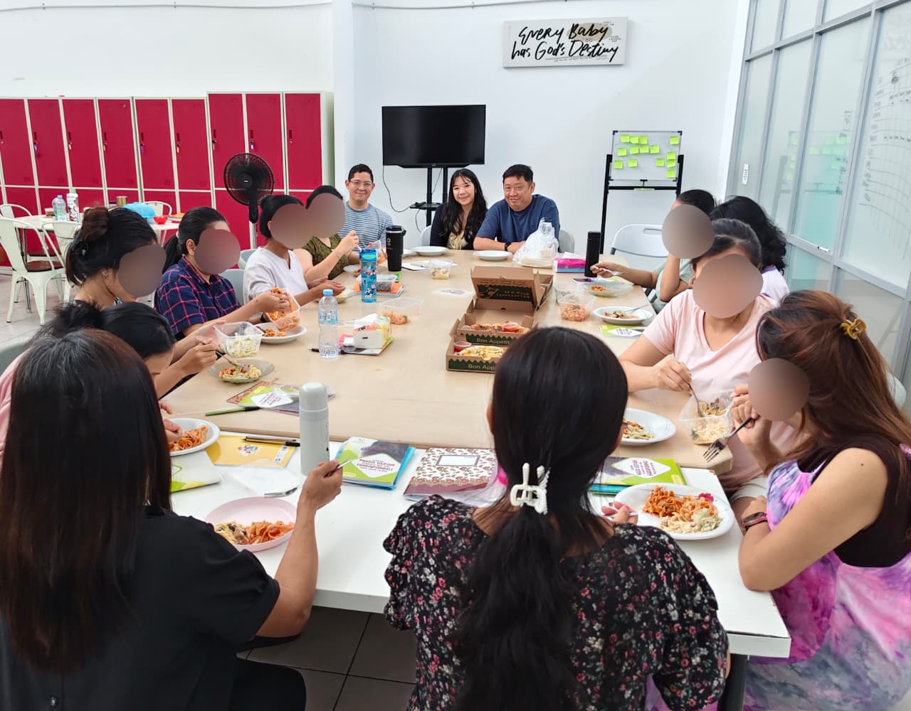 The Blessing the Home team sharing a meal